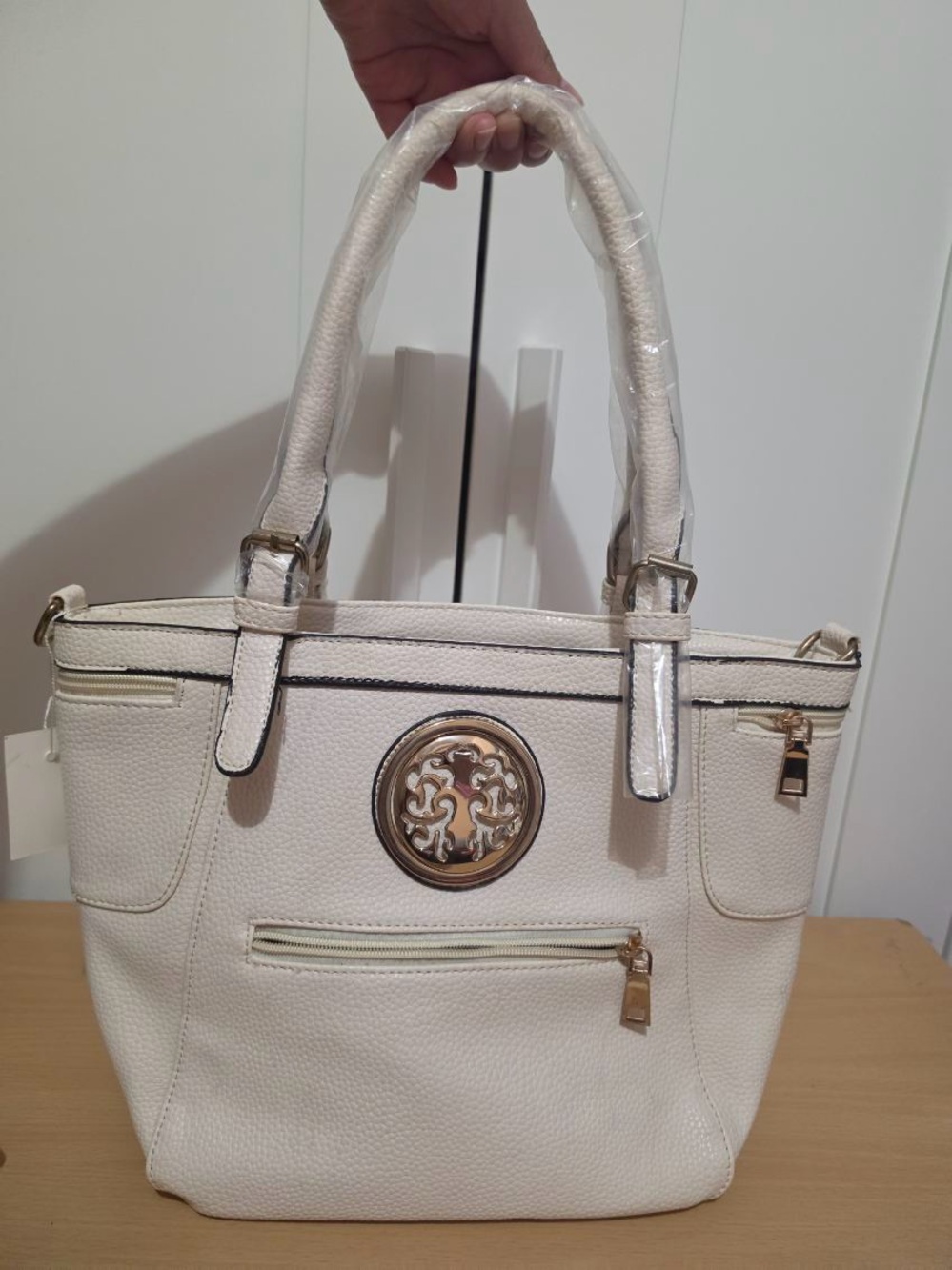 Structured White Women's Tote with Gold Medallion Accent